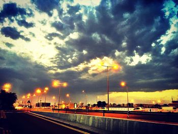 Road passing through dramatic sky