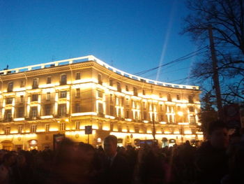 Group of people in front of buildings