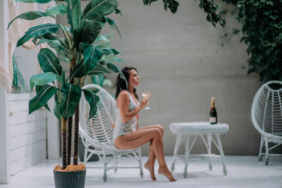 Woman sitting on table