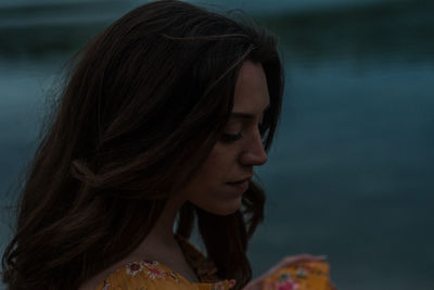 Close-up of young woman looking away