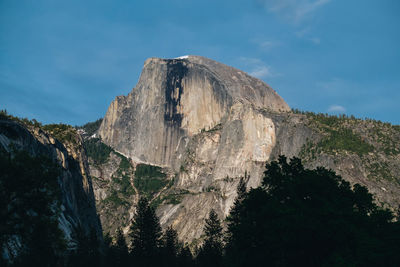 Low angle view of rock formations against sky