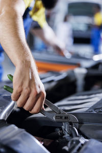 Cropped hand of man working in workshop