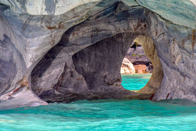 Scenic view of sea seen through cave