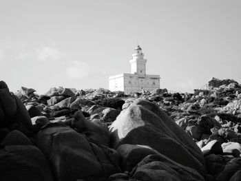 View of lighthouse against buildings