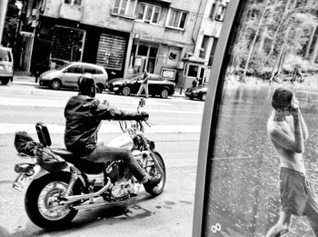 Man riding bicycle on city street