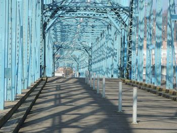 Metallic bridge in city during sunny day