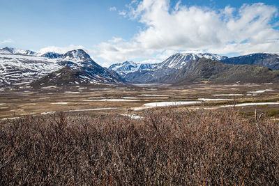 Scenic view of snowcapped mountains against sky