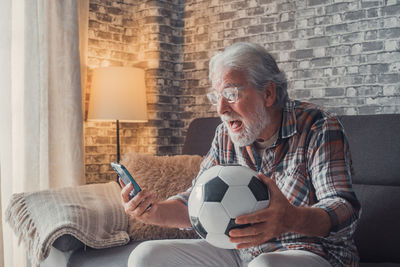 Man playing soccer ball