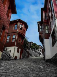 Footpath amidst buildings in town