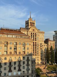 Buildings in city against sky