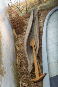 High angle view of wicker basket on tree trunk