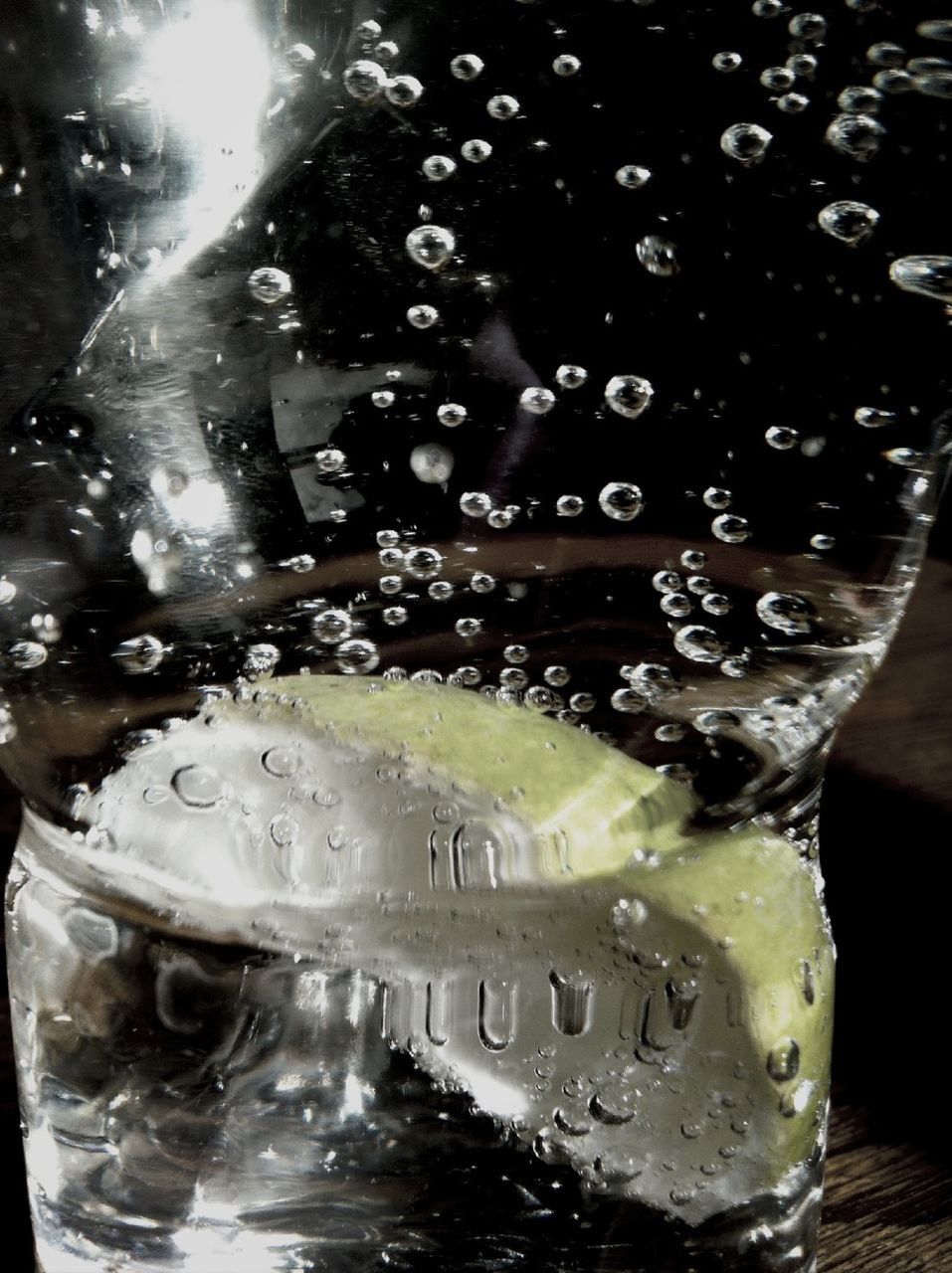 close-up, water, glass - material, text, freshness, transparent, refreshment, indoors, drink, food and drink, wet, drinking glass, reflection, communication, western script, day, sunlight, cold temperature, ice