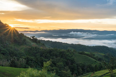 Scenic view of mountains against sky during sunset