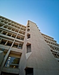 Low angle view of building against clear blue sky