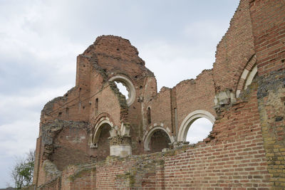 Low angle view of old building against sky