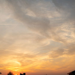 Low angle view of dramatic sky during sunset