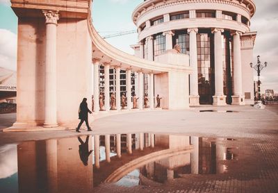 People walking in historic building