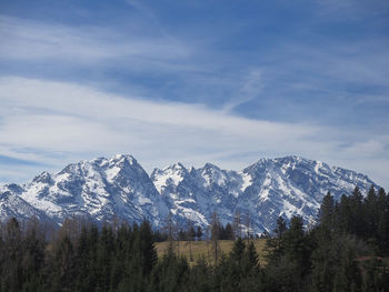 Scenic view of snowcapped mountains against sky
