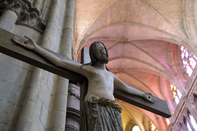 Low angle view of statue against building