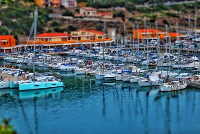 High angle view of sailboats moored at harbor