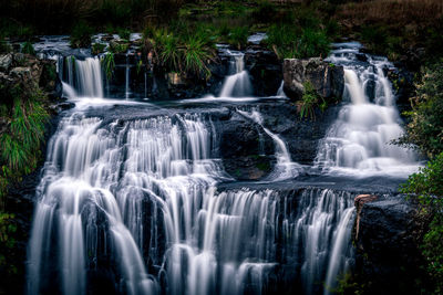 Scenic view of waterfall in forest