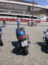 People riding motorcycle on street