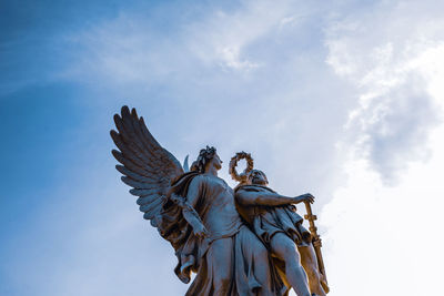 Low angle view of statue against sky