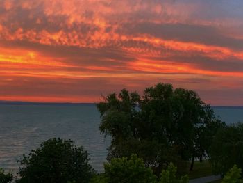 Scenic view of sea against orange sky