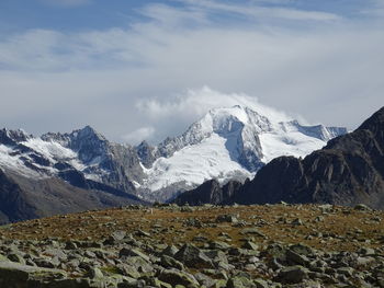 Scenic view of snowcapped mountains against sky