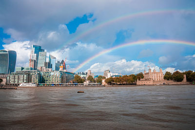 Beautiful view of the tower bridge in london with a full rainbow over it