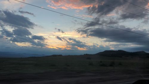 Scenic view of silhouette landscape against sky during sunset