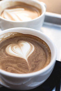 Close-up of cappuccino on table