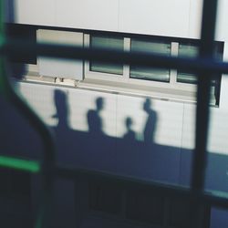 Shadow of people on subway train