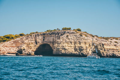 Scenic view of sea against clear blue sky