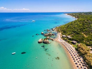 Aerial view of sea and landscape against sky