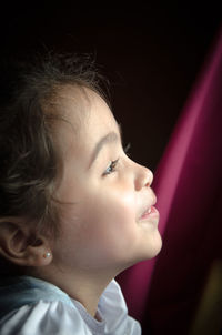 Close-up of young woman looking away