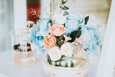 Close-up of flower vase on table at home