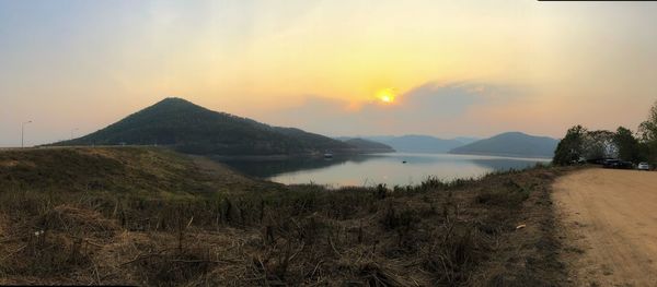 Scenic view of lake against sky during sunset