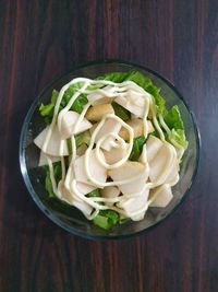 High angle view of chopped vegetables in bowl on table