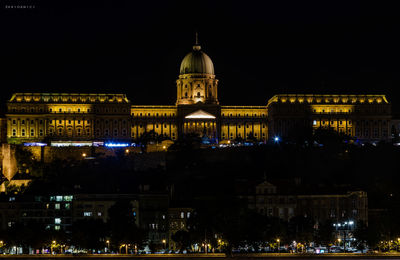 Illuminated buildings in city at night