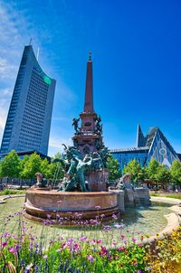 View of temple building against blue sky