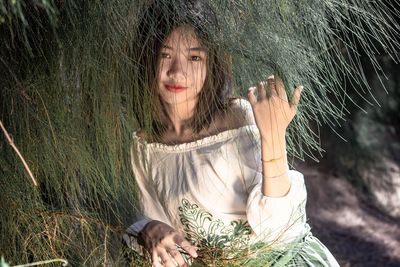 Portrait of beautiful woman with pine trees natural beauty