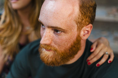 Close-up portrait of young man looking away