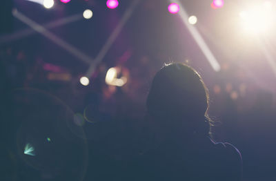 Concert dark background, smoke, spotlights. bright lights person