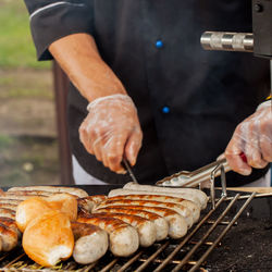 Man preparing food on barbecue grill