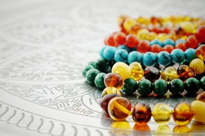 Close-up of bead necklace on table