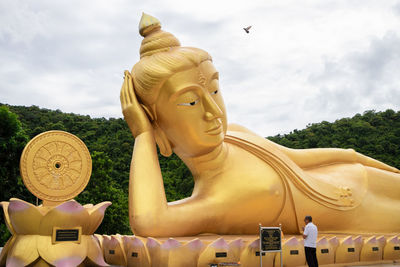 Low angle view of statue against sky