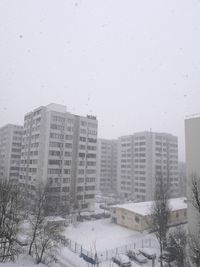 Buildings in city during winter