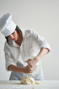 Midsection of woman holding ice cream