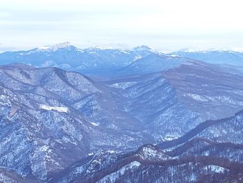 Scenic view of snowcapped mountains against sky